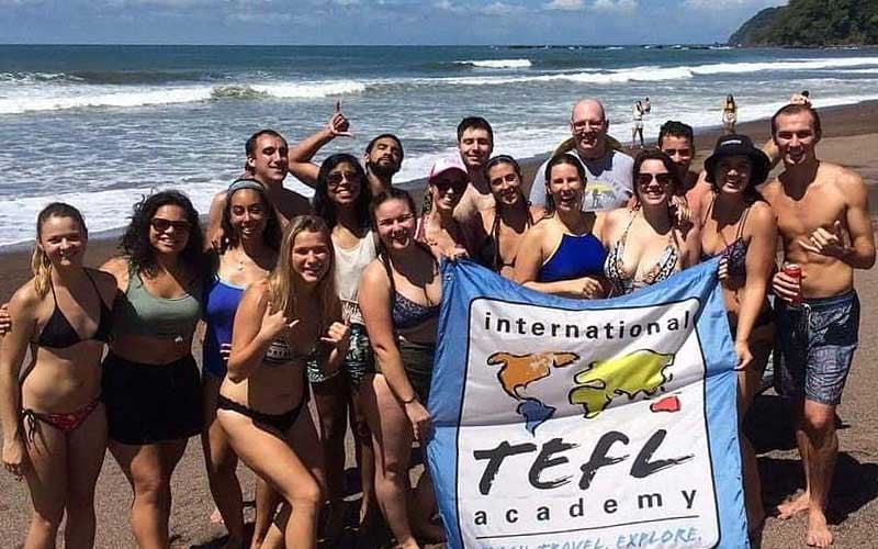 ITA graduates enjoy gathering on a beach in Costa Rica